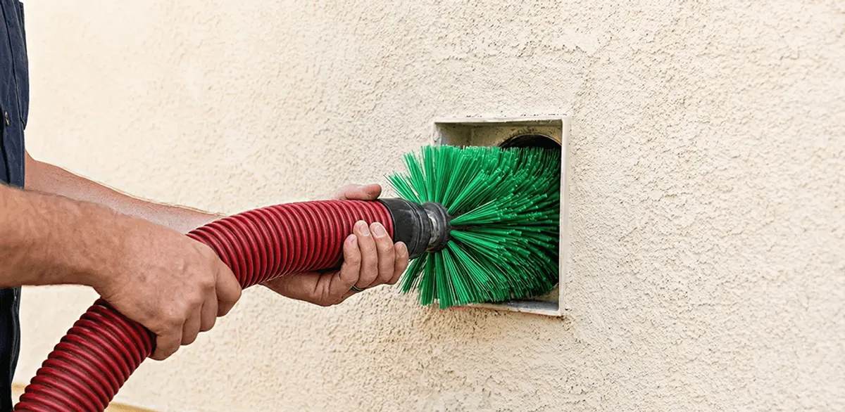 Air duct cleaning brush removing debris from a vent opening in Nashville, TN
