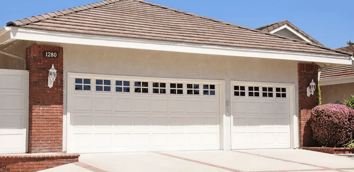 Residential garage door repair service for a double garage door in Nashville, TN